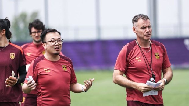 China coach Ante Milicic with his interpreter, Tracy Gu.