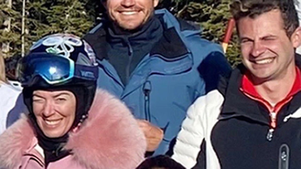 Melissa Caddick, wearing a $3000 Moncler ski jacket, is pictured with her husband Anthony Koletti in Aspen in January 2020. 