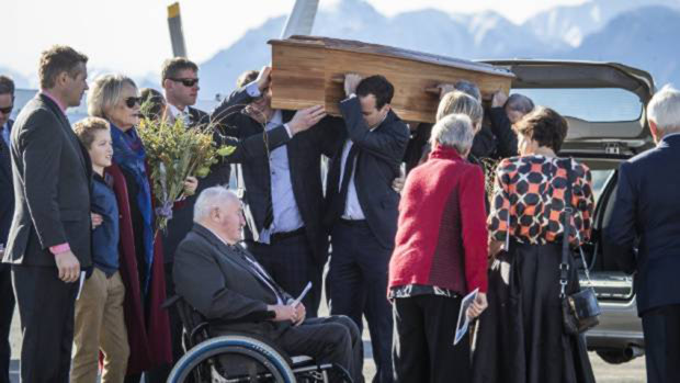 The funeral for Matt Wallis at Wanaka Airport in July, with Nick Wallis standing at the back.