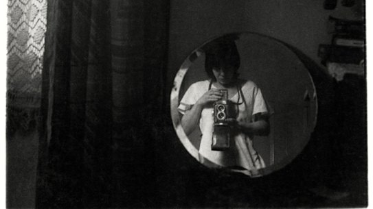 Viva Gibb, Self-portrait, 64 Capel Street, West Melbourne, c. 1975-78, silver gelatin print, 14 x 9 cm.