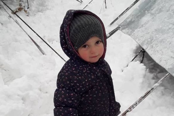 Fatema, 2, the daughter of Mariam Dabboussy and granddaughter of activist Kamalle Dabboussy, in the snow at al-Hawl camp this week.