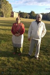 Mr Sharma’s parents, pictured on a trip to Australia, are stuck at home in India with COVID-19, unable to access hospital care.