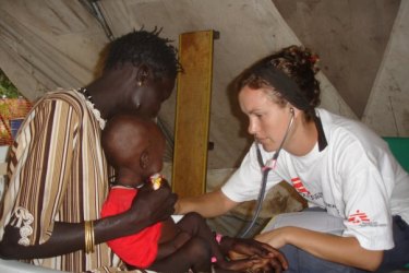 Kent nursing a child in 2007 at the Therapeutic Feeding Centre in Leer, a town in what is now known as South Sudan.