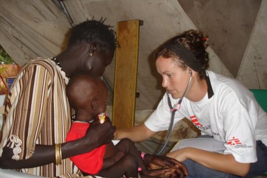 Kent nursing a child in 2007 at the Therapeutic Feeding Centre in Leer, a town in what is now known as South Sudan.