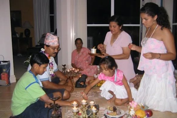 My Maa (middle) at a traditional Nepalese puja ceremony in my childhood home on the Sunshine Coast.
