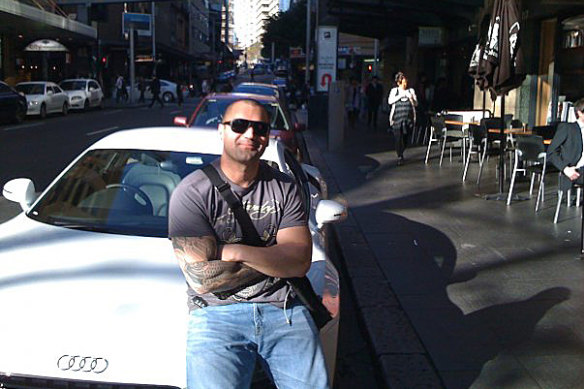 Ayik liked posing with luxury cars.