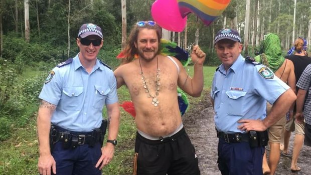A reveller poses with NSW Police officers at a previous iteration of Bohemian Beatfreaks.