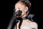 Ariana Grande breaks down on stage at LA concert