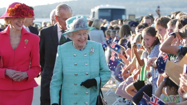 The Queen on a “walkabout” in 2011 in Canberra with Governor-General Quentin Bryce and Prince Philip (behind).