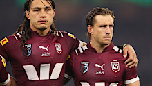 Tino Fa'asuamaleaui and Cameron Munster of the Maroons line up for the national anthem.