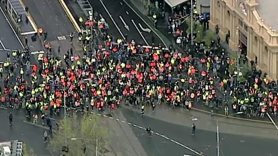 Stills from helicopter footage of the protest on Tuesday outside the CFMEU headquarters in Melbourne.