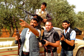 Darren Conway filming with Free Syrian Army fighters outside Aleppo.