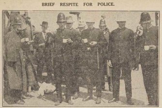 Time for a cuppa: Police take a break before crushing protests by dockworkers on Princes Pier in 1928.