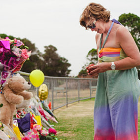 Rosie Batty visits the tributes left at the Tyabb oval after Luke’s killing by his father Greg Anderson.