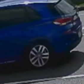 The blue Hyundai hatch.