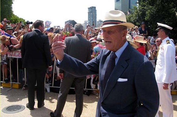Prince Phillip calls across Jazmine and Jessica Melrose to personally hand their flowers to the Queen when the Royal couple visited Brisbane in 2011.