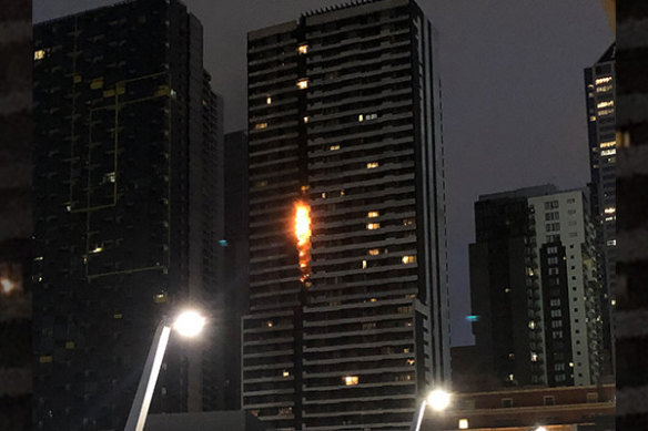 A fire fuelled by flammable cladding races up the side of the Neo200 tower in 2019.