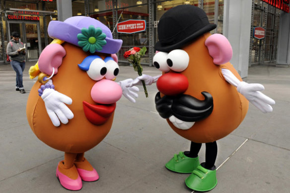 Mr. Potato Head (R) gives Mrs. Potato Head flowers outside of Hasbro’s American International Toy Fair.