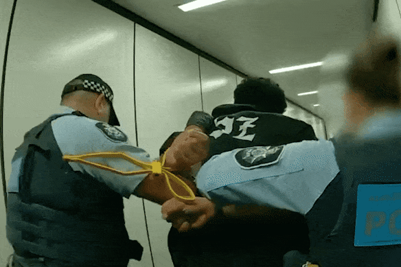 A New Zealand man is arrested after a flight lands in Melbourne.