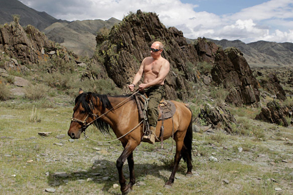 Russian Prime Minister Vladimir Putin rides a horse during his holiday outside the town of Kyzyl in Southern Siberia.
