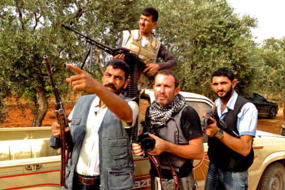 Darren Conway filming with Free Syrian Army fighters outside Aleppo.