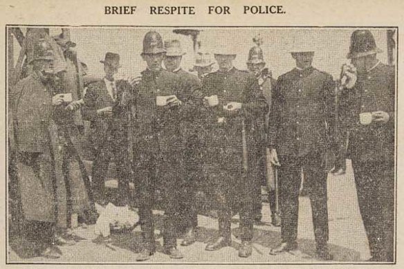 Time for a cuppa: Police take a break before crushing protests by dockworkers on Princes Pier in 1928.