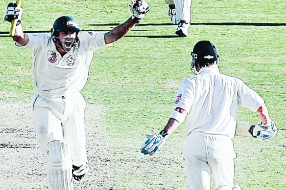 Mike Hussey and Michael Clarke celebrate a remarkable Ashes win in Adelaide.