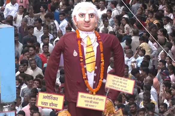 A giant Trump effigy was paraded around a festival in the state of Maharashtra last week.