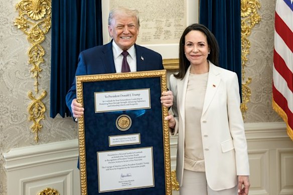 Donald Trump and Maria Machado with the Nobel Peace Prize at the White House on Thursday.