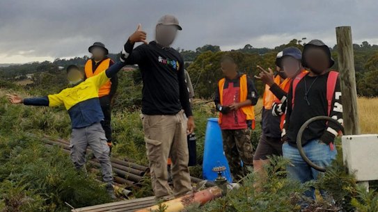 The worker, front, said he and his workmates had to resort to fishing to feed themselves.