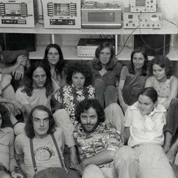 Employees and volunteers at 4ZZ - later 4ZZZ - in 1975. Front row: Jim Beatson, Stuart Matchett, John Woods, Sue Horton, Gordon Curtis. Second row: Evan Kelly, Ian Nicholson, Ross Crighton, Brian Watson, Helen Hambling, Ashleigh Merritt, Carole Ferrier, Marian Wilkinson, Gay Walsh and Rob Cameron.