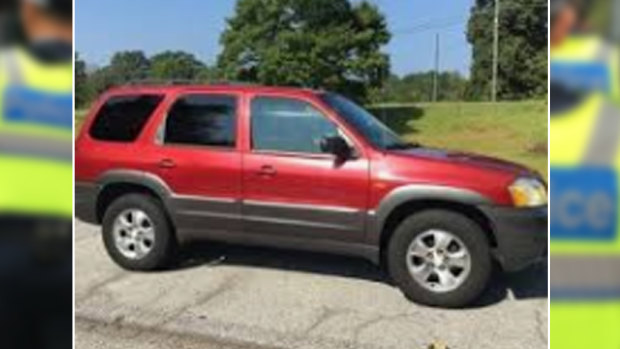 The man and woman were in a red/maroon 2003 Mazda Tribute similar to this one. 