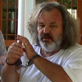 Another day, another set of handcuffs: Peter Foster.