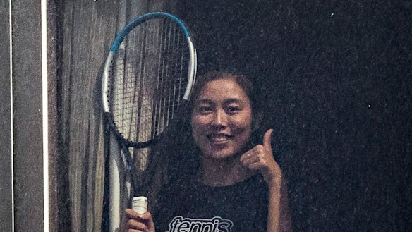 Tennis player Chan Hao-ching (also known as Angel Chan) gives the thumbs up from her hotel quarantine at the View hotel ahead of the Australian Open in Melbourne.