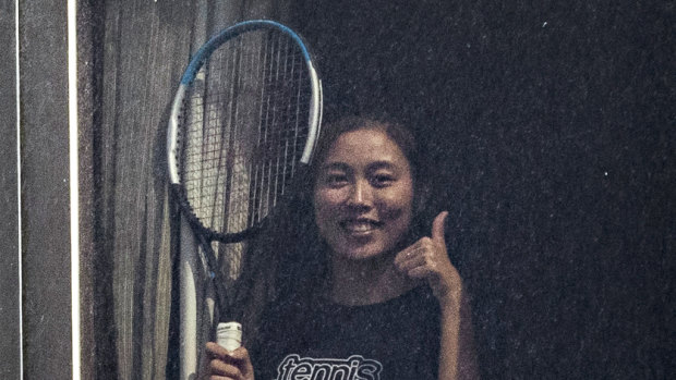 Tennis player Chan Hao-ching (also known as Angel Chan) gives the thumbs up from her hotel quarantine at the View hotel ahead of the Australian Open in Melbourne.