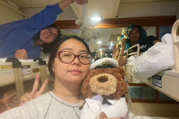 Teenager Kaitlyn Soh (left) with her mother Aun Na Tan and brother Xander in their cabin on the Diamond Princess.