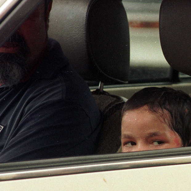 Jandamarra O’Shane peers from his father’s car during a fleeting visit to the Cairns Courthouse, where Paul Wade Streeton awaited his verdict in 1997. 