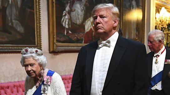 The Queen and US President Donald Trump arrive through the East Gallery ahead of the State Banquet at Buckingham Palace.