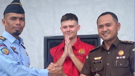 Bodhi Mani Risby-Jones with prison and prosecution officials before his release on Tuesday.