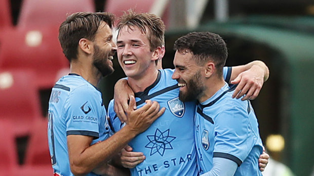 Calem Nieuwenhof celebrates his maiden A-League goal with Milos Ninkovic and Anthony Caceres.