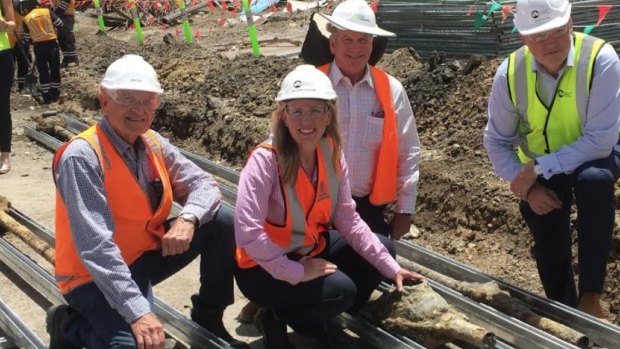 Tourism Industry minister Kate Jones with Destination Brisbane project director Simon Crooks (right) at the unearthing of the 134-year-old electrical cables.