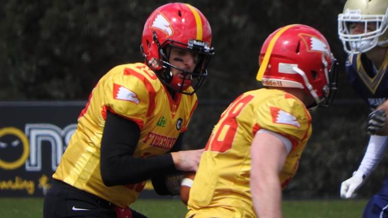 Firebirds quarterback Luke Job hands off to No.28 James Thornhill.
