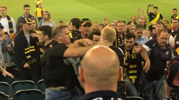 Footage shows a group of men involved in the brawl, while the Tigers club song plays in the background.