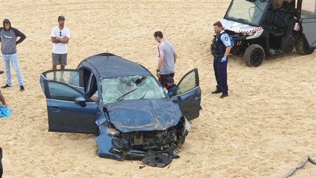 The scene after the car crashed onto Maroubra Beach on Wednesday.