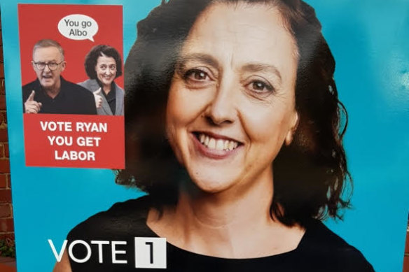 A photograph of an sticker posted on a Monique Ryan billboard linking her to the Labor Party.