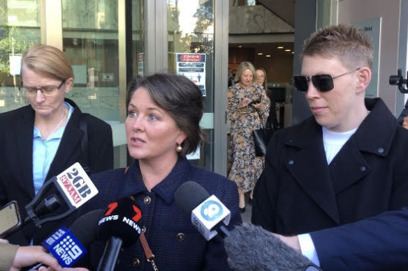 Sarah Monaghan (centre) after the State Parole Authority hearing for convicted paedophile Robert Hughes.