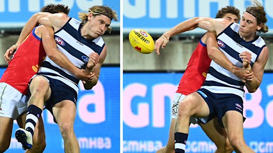 Geelong’s Mark Blicavs tackles Lion Zac Bailey,