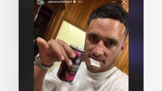 Valentine Holmes with a bag of white powder in his mouth.