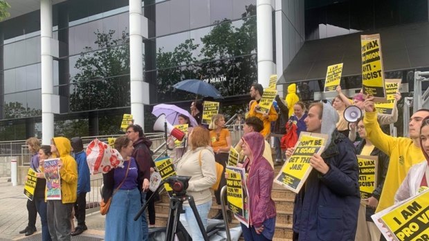 Pro-vaccine protestors at health HQ on Friday,