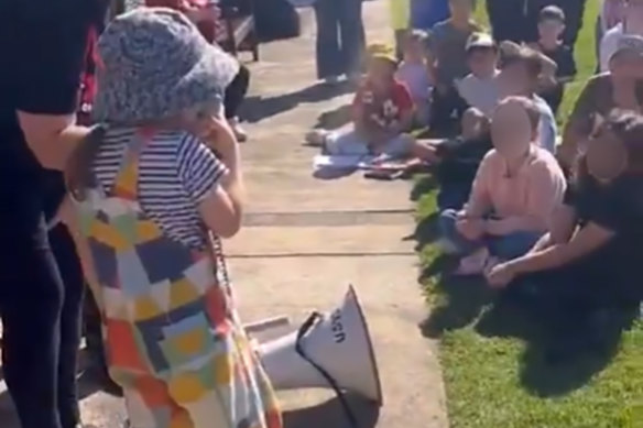 Children led chants using megaphones.